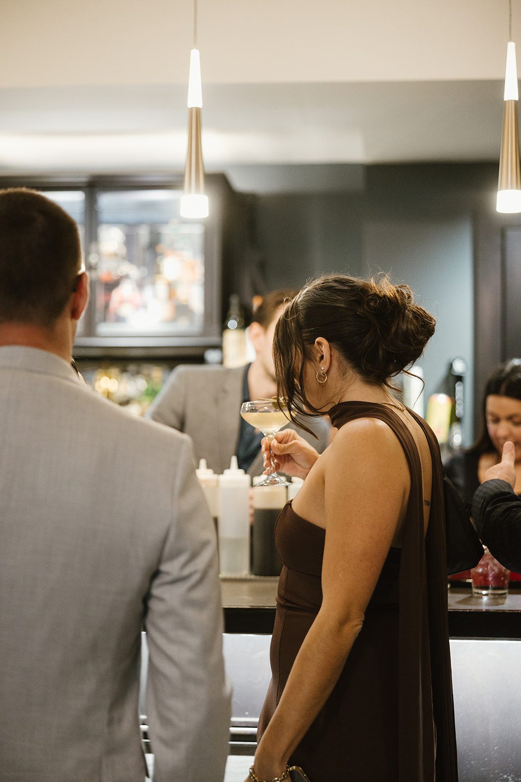 Guest at the bar with a cocktail