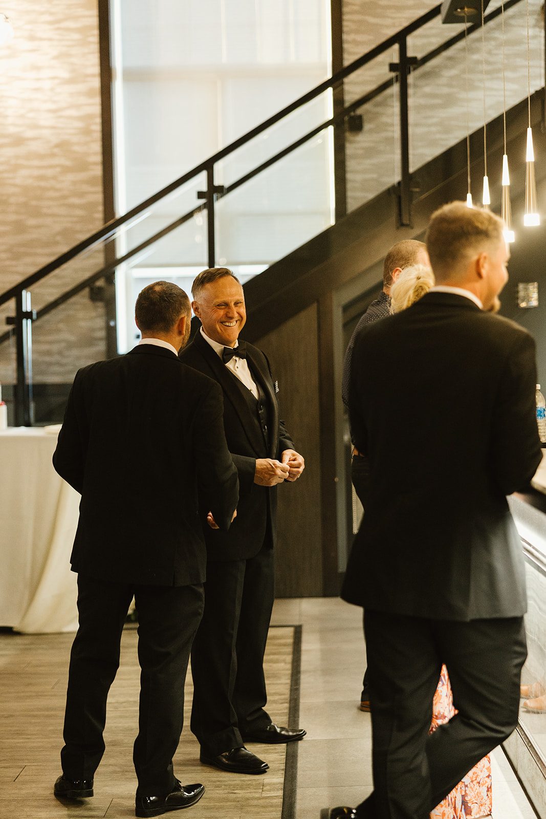 Guests laughing near the staircase